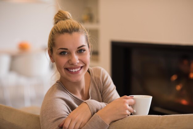 files/portrait-beautiful-young-woman-with-mug-near-fireplace_530697-61759.jpg